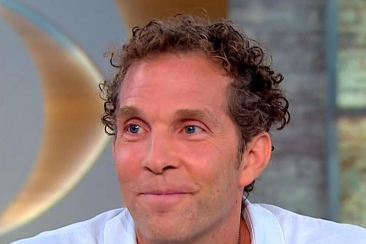 Jesse Itzler net worth: Entrepreneur smiling, showcasing his success across various industries that contributed to his $1.2 billion estimated fortune.