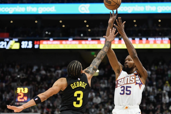 Suns vs Jazz players battling for possession during an intense NBA game, showcasing the rivalry's competitiveness.